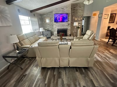 Cozy common area with seating and a TV.