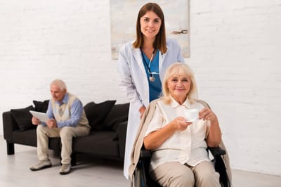 Healthcare professional with resident in a common area