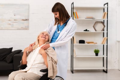 Nurse assisting a resident in a comfortable setting.