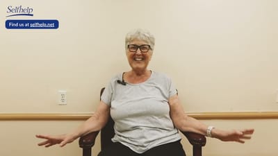 Resident joyfully engaging in conversation.