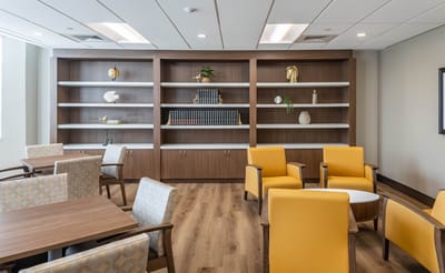 Bright common area with seating and shelves