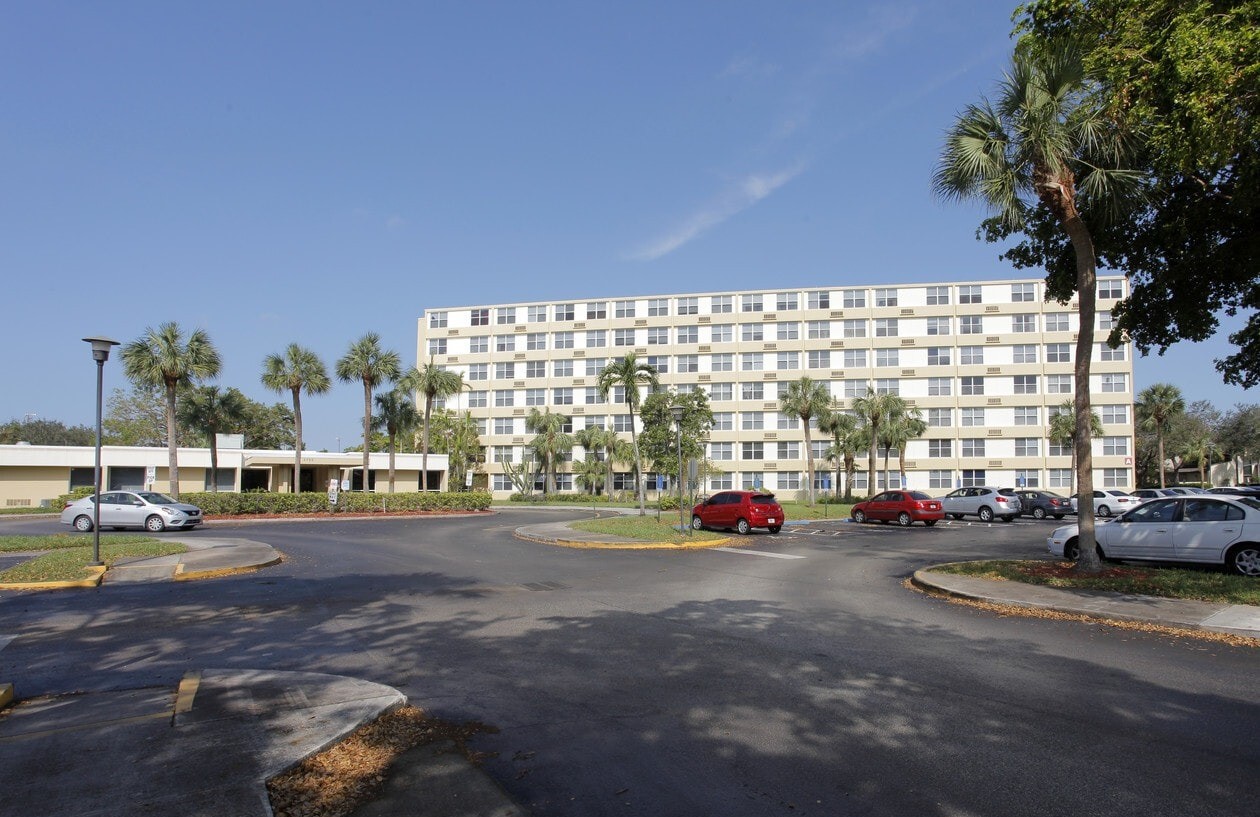 Exterior view of St. Andrews Towers community building with parking