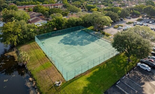 Aerial view of an outdoor tennis court area