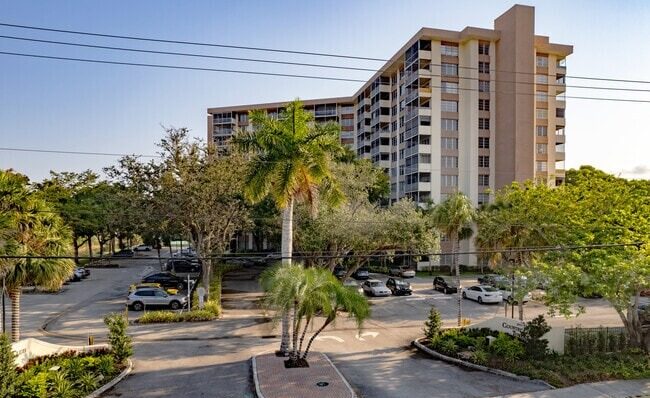 Exterior view of Country Club Tower with palm trees