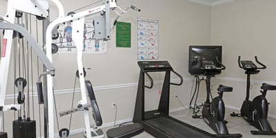 Well-equipped fitness room with exercise machines