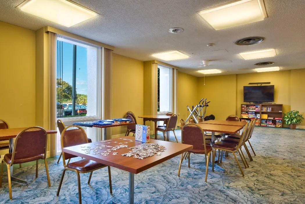 Bright interior common area with tables and chairs
