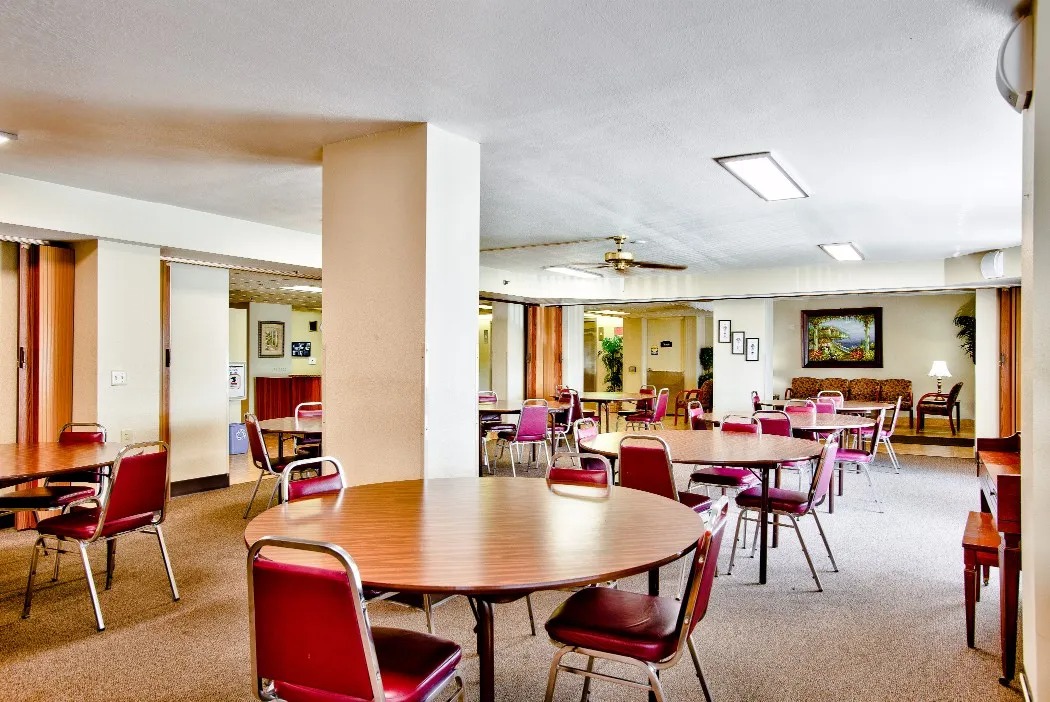 Interior view of a common area with tables and chairs