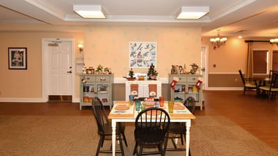 Bright interior common area with dining setup