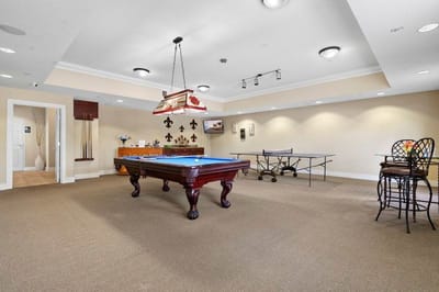Interior common area with pool table and seating