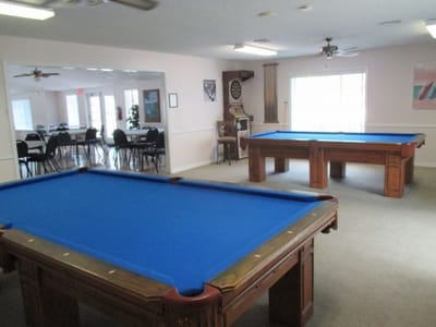 Interior view of a game room with billiard tables