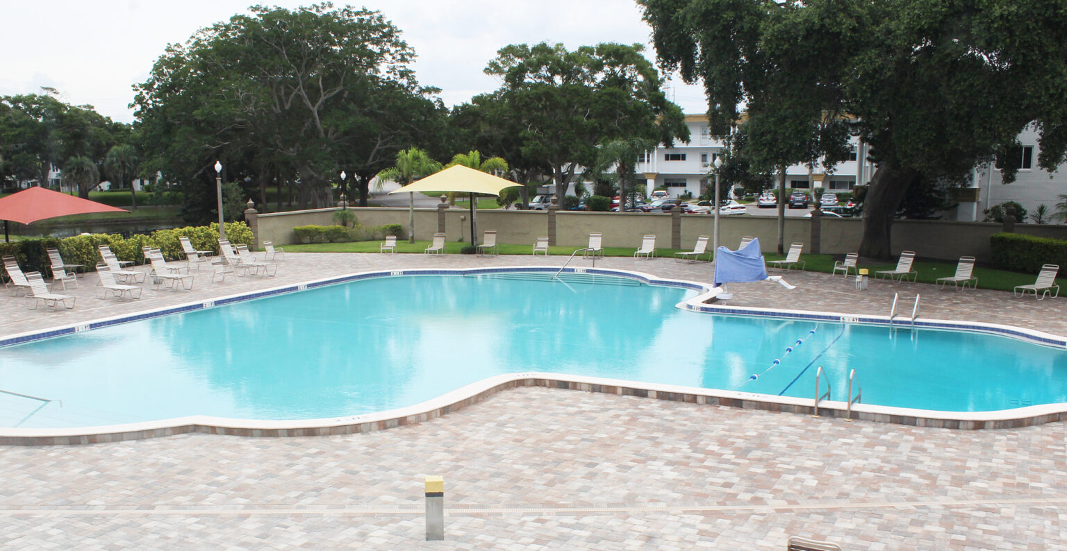 Swimming pool surrounded by lounge chairs