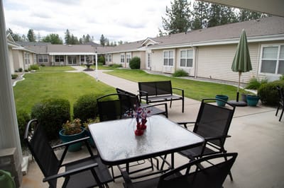 Outdoor seating area with tables and chairs