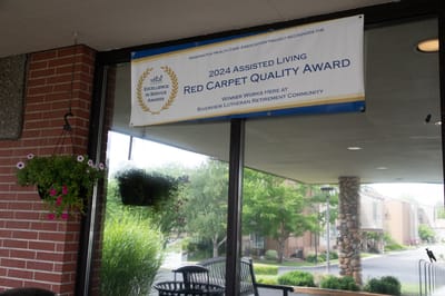 Award banner hanging outside the facility entrance