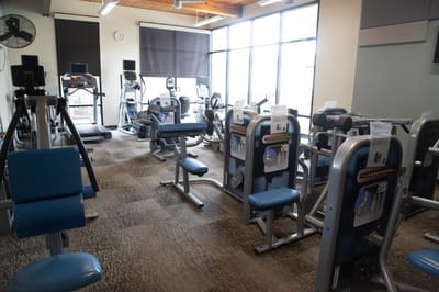Well-equipped fitness room with exercise machines