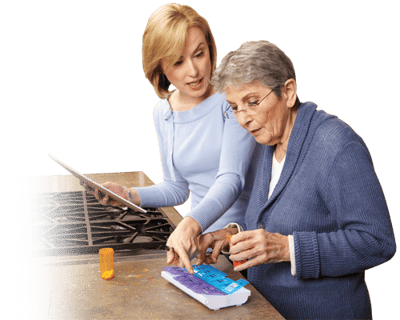 Caregiver assisting a senior with medication management