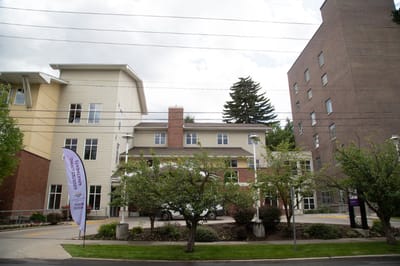 Exterior view of a senior living facility with landscaping