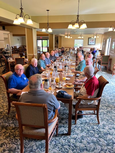 Residents enjoying a meal together in the dining room