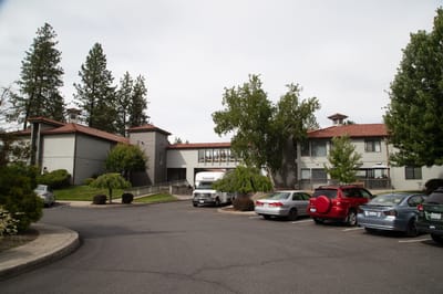 Exterior view of Fairwood Retirement Village with parking area