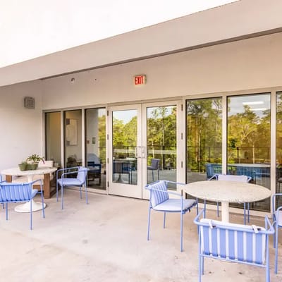 Outdoor patio area with seating and tables