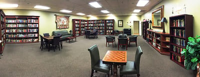 Bright interior of a library with bookshelves and seating