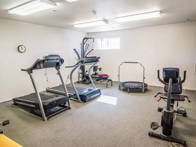 Interior view of a fitness room with exercise equipment