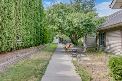 Pathway in a serene outdoor space with seating