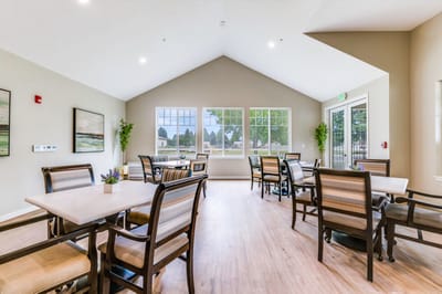 Bright common area with seating and large windows