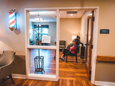 A resident relaxing in the beauty salon