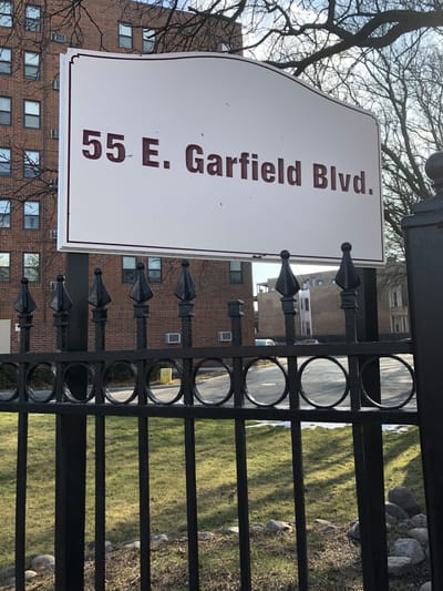 Sign for a nursing home on a street