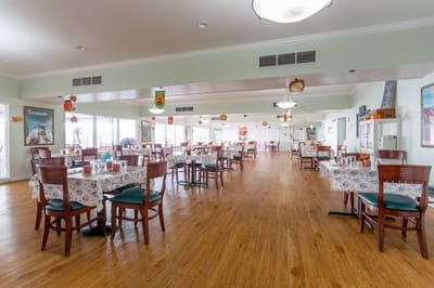 Interior view of a spacious dining room with tables