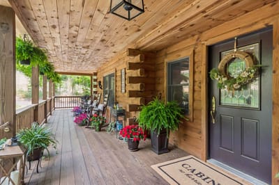 Welcoming porch with flowers and wooden accents