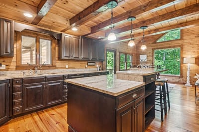 Bright and modern kitchen interior with wooden beams