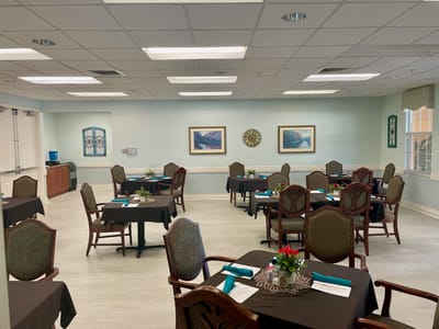 Bright dining area with set tables and decorations