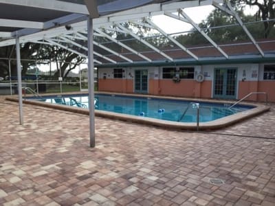 Pool area with a partially covered deck
