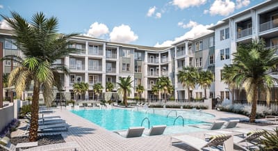 Outdoor pool area with palm trees and lounge chairs