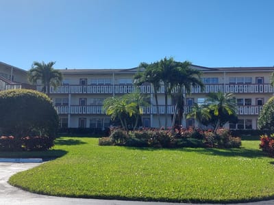Exterior view of Century Village at Boca Raton with landscaping