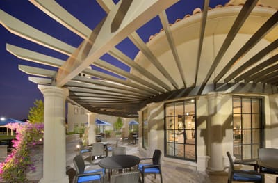 Outdoor seating area with pergola at the facility