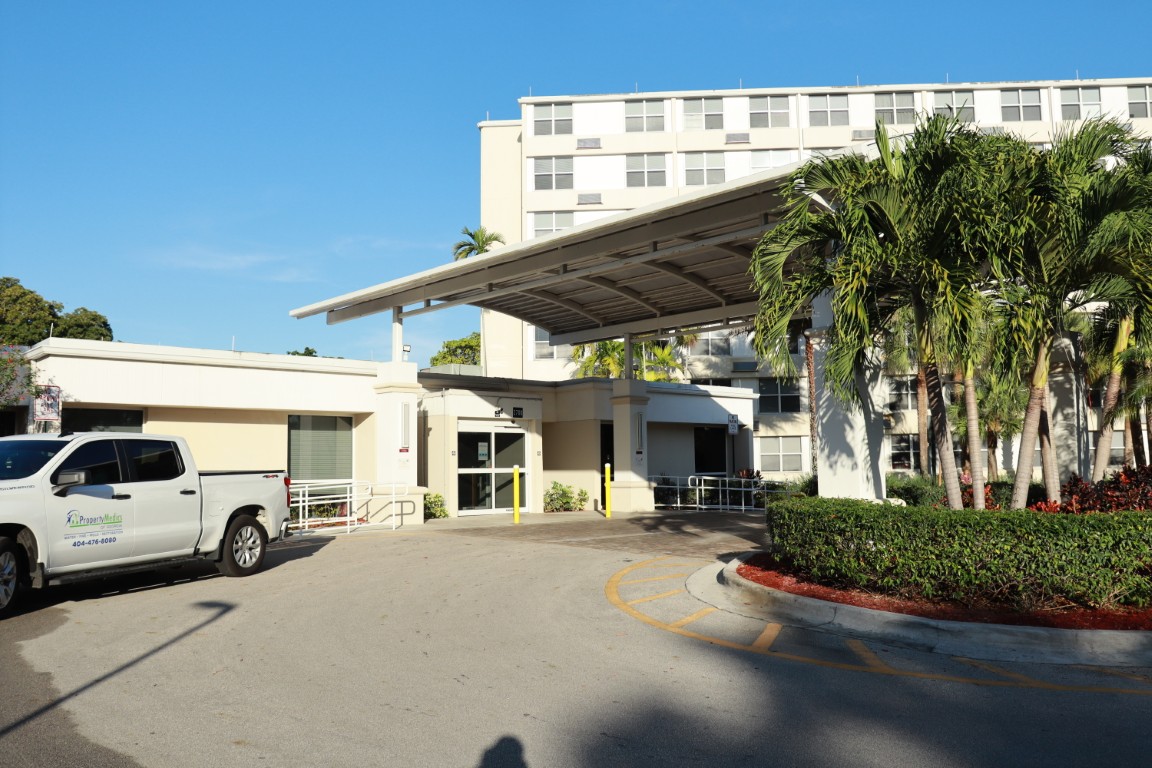 Entrance of a senior living facility with a covered area