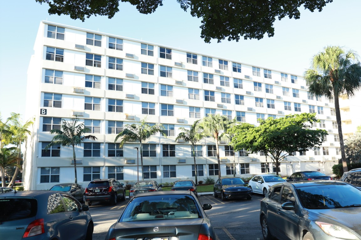 Exterior view of St. Andrews Towers with parking area