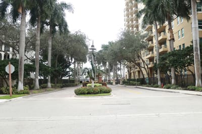 Entrance view of Sunrise Harbor with palm trees