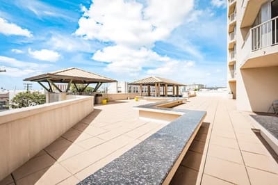 Outdoor patio space with shaded seating areas
