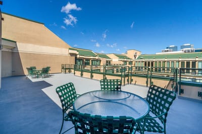Outdoor patio area with seating and clear sky