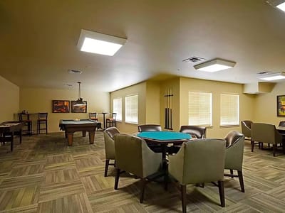 Interior view of a common area with seating and games