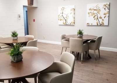 Interior common area with dining tables and decor