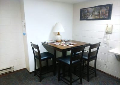 A small social area with a table and chairs