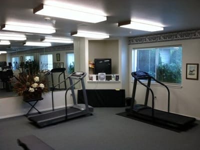 Fitness area with treadmills and floral decor