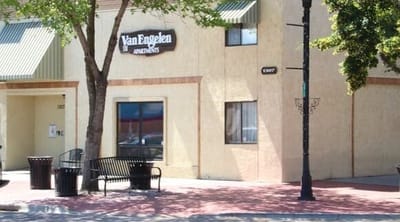 Exterior view of Van Engelen apartments with seating area