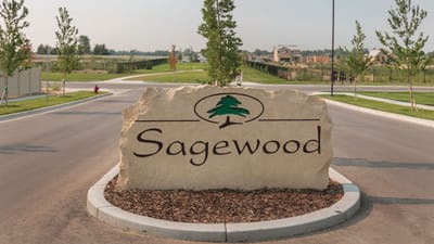 Facility logo displayed on a stone sign