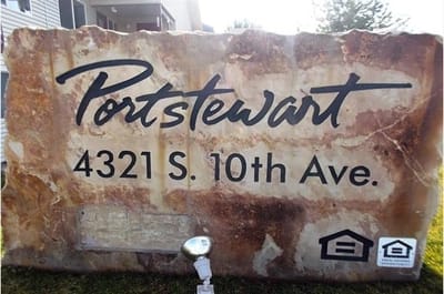 Signage stone with facility name and address
