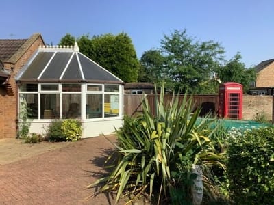 Outdoor view of a conservatory with surrounding greenery